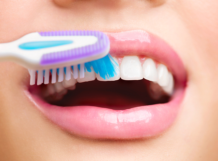 Teeth brushing. Beautiful white healthy teethの写真素材