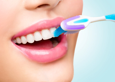 Teeth brushing. Beautiful white healthy teethの写真素材