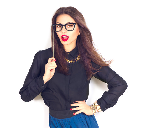 Beauty sexy fashion model girl wearing funny paper glasses on stickの写真素材