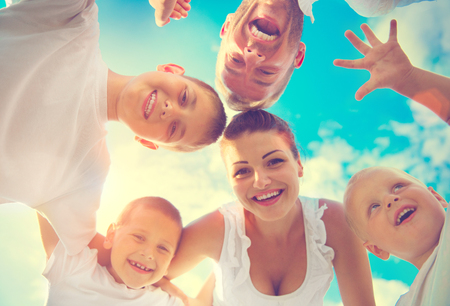 Happy young big family with three children having fun togetherの写真素材