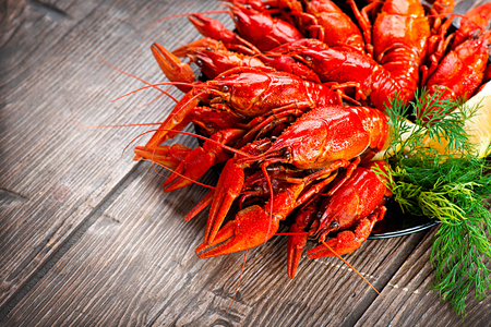 Crayfish. Red boiled crawfish on a wooden table in rustic styleの写真素材