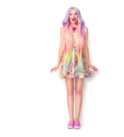Beautiful young woman with a long colorful hair. Full length portraitの写真素材