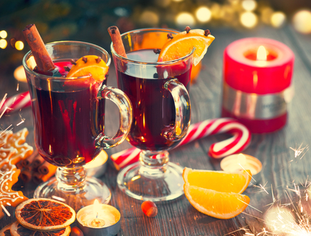Christmas hot mulled wine with cinnamon stick, slices of orange and spicesの写真素材