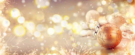Golden Christmas holiday abstract glitter defocused backgroundの写真素材