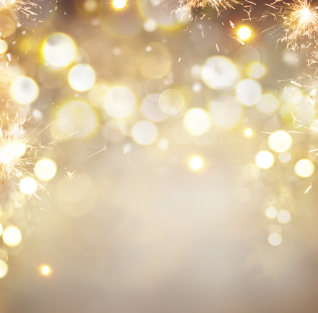 Golden Christmas holiday abstract glitter defocused backgroundの写真素材