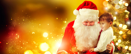 Santa Claus and little boy. Christmas sceneの写真素材