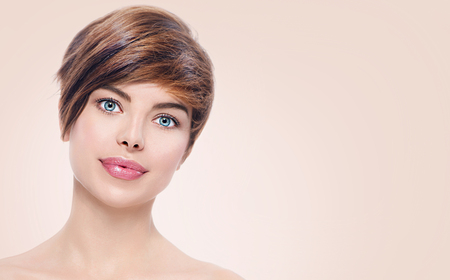 Beautiful young spa woman with short hair portraitの写真素材