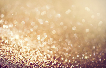 Abstract golden holiday glowing backgroundの写真素材