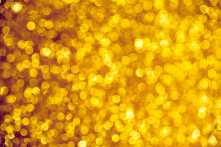 Abstract golden holiday glowing backgroundの写真素材