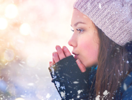 Winter girl portrait. Joyful teenage model girl having fun in winter park