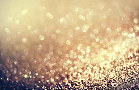 Abstract golden holiday glowing backgroundの写真素材