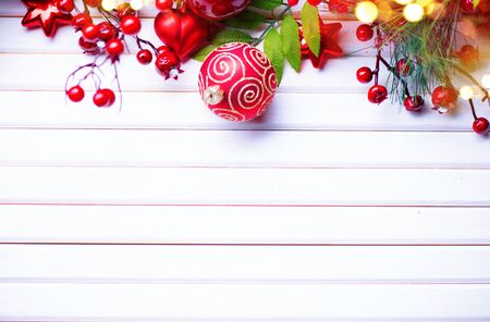 Christmas and New Year decoration over white wooden background. Border art design with holiday baublesの写真素材