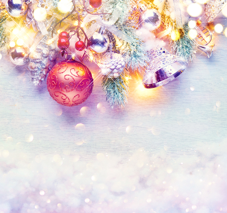 Christmas and New Year decoration over white wood background. Border art design with holiday baublesの写真素材