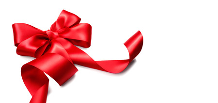 Red satin gift bow. Ribbon isolated on white backgroundの写真素材