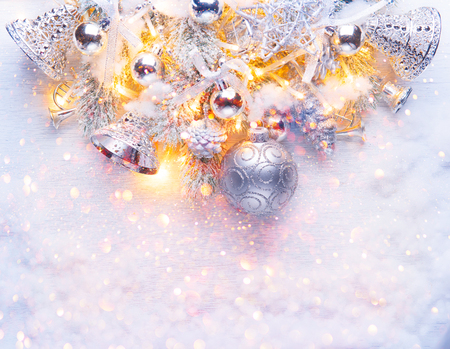 Christmas and New Year decoration over white wood background. Border art design with holiday baublesの写真素材