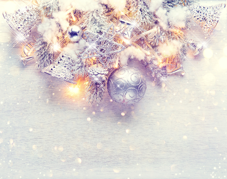 Christmas and New Year decoration over white wood background. Border art design with holiday baublesの写真素材