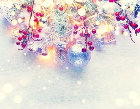 Christmas and New Year decoration over white wood background. Border art design with holiday baublesの写真素材