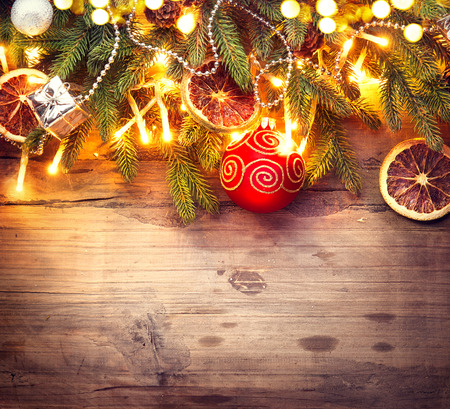Christmas border art design. Decorated Christmas tree over wooden backgroundの写真素材