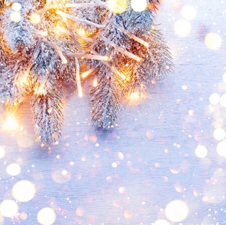 Christmas decoration holiday tree over white wood backgroundの写真素材
