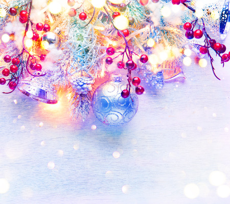 Christmas and New Year decoration over white wood background. Border art design with holiday baublesの写真素材