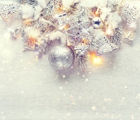 Christmas and New Year decoration over white wood background. Border art design with holiday baublesの写真素材