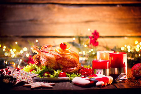 Christmas holiday family dinner. Decorated table with roasted turkeyの写真素材