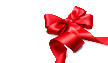 Red satin gift bow. Ribbon isolated on white backgroundの写真素材