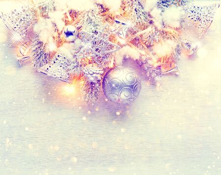 Christmas and New Year decoration over white wood background. Border art design with holiday baublesの写真素材