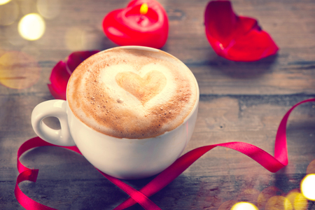 Valentine's Day coffee with heart on foam. Love concept. Romantic Valentine backgroundの写真素材