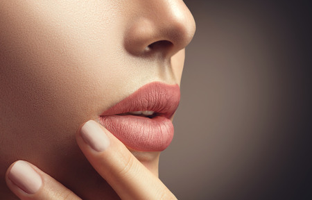 Beauty sexy woman with natural makeup and beige nail polishの写真素材