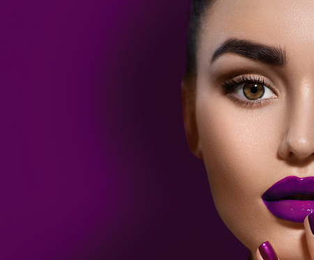 Beauty brunette woman with professional holiday makeupの写真素材