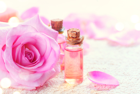 Bottles of essential rose oil for aromatherapy. Rose spa conceptの写真素材