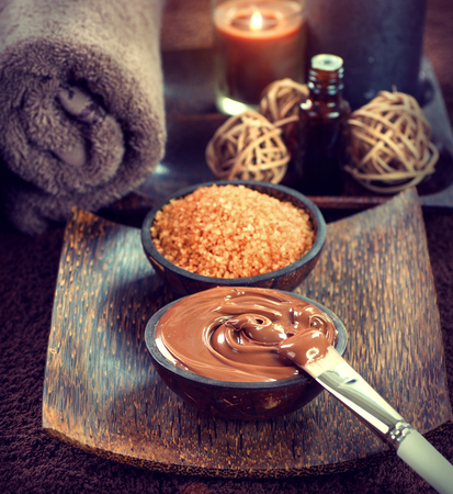Spa treatment. Chocolate mask, bath salt, brown sugar scrub for skinの写真素材