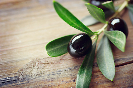 Olive over wood background. Fresh and healthy organic olives border designの写真素材