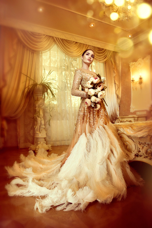 Beauty gorgeous woman in beautiful evening dress in luxurious style interior room. Elegant lady full length portraitの写真素材
