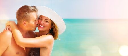 Middle aged couple enjoying romantic summer beach holidays. Travel and vacation conceptの写真素材