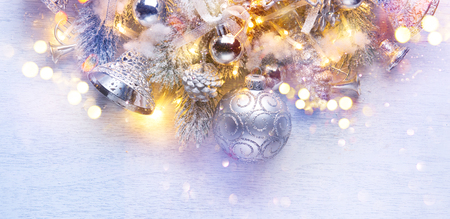 Christmas decoration over white wooden background. Border art design with holiday baublesの写真素材