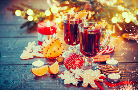 Christmas traditional mulled wine on holiday decorated tableの写真素材