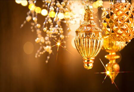 Christmas and New Year golden decorations. Abstract blinking holiday backgroundの写真素材