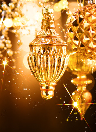 Christmas and New Year golden decorations. Abstract blinking holiday backgroundの写真素材