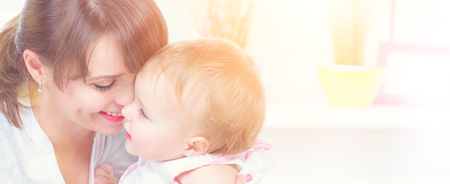 Happy family at home. Mother and her little daughter together. Maternity concept. Parenthoodの写真素材