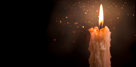 Candle flame closeup on a darkの写真素材