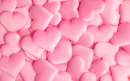 Valentine's Day. Holiday abstract pink Valentine background with satin hearts. Love conceptの写真素材