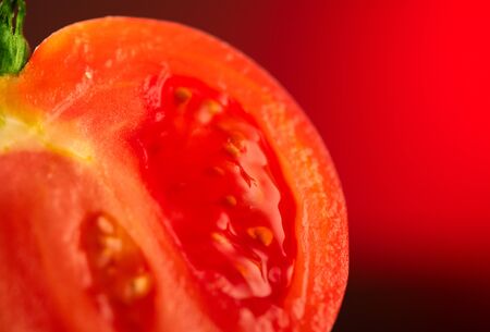 Tomato. Ripe natural tomatoes closeup. Organic tomato on redの写真素材