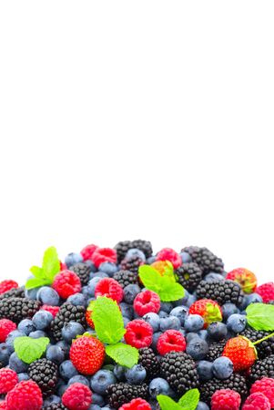 Berries. Various colorful berries background. Strawberry, raspberry, blackberry, blueberry closeup over white. Healthy eatingの写真素材