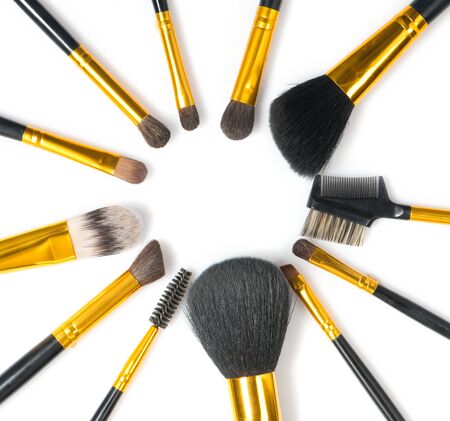 Make-up Brushes set over white background. Various Professional makeup brush on white in studio. Make up artist tools. Flatlay, top view, flatlay backdropの写真素材