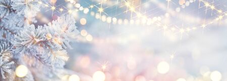 Christmas background. Xmas tree with snow decorated with garland lights, holiday festive background. Widescreen frame backdrop. New year Winter art design, Christmas scene wide screen holiday borderの写真素材