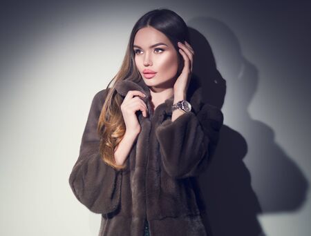 Beauty Fashion Model Girl in brown Mink Fur Coat portrait.の写真素材