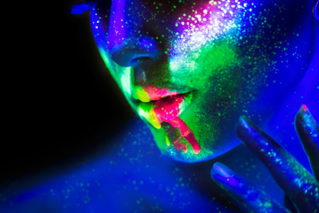 Neon paint lips and face on a woman