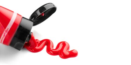 Red color Acrylic Paint tube isolated on white background. Art, canvas, painter. Painting concept. Close-upの写真素材